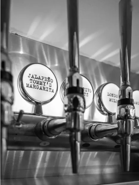 Rififi's cocktail taps, with labels such as Jalapeño Tommy's Margarita and London Mule